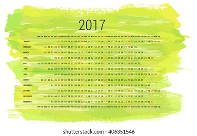 A year 2017 scalable vector desk calendar on a light green watercolor brush strokes texture