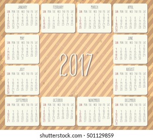 Year 2017 vector monthly calendar with hand drawn text over vintage brown striped textured grunge background. Week starting from Sunday.
