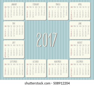 Year 2017 vector monthly calendar with hand drawn text over pastel blue striped background. Week starting from Sunday.