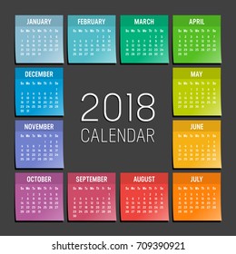 Year 2018 seasonal calendar. Agenda with colorful sticky notes, isolated on a black background