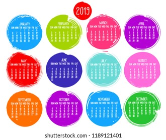 Year 2019 contemporary vector monthly calendar. Week starting from Sunday. Hand drawn brush stroke multicolor circle design over white background.