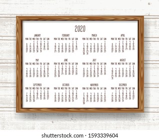 Year 2020 vector monthly calendar. Hand drawn text in a wooden frame over rustic distressed light brown and white wood background. Week starting from Monday.