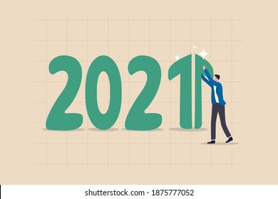 Year 2021 economic recovery, growth and positive GDP income or investment earning increasing concept, smart happy businessman investor make a green rising arrow graph on number 1 of 2021 year number.