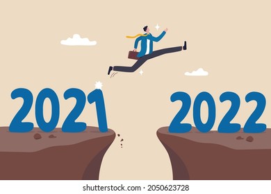 Year 2022 hope, new year resolution or success opportunity, change to new business bright future, overcome business difficulty concept, ambitious businessman jump over year gap from 2021 to 2022.