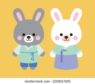 The year 2023 is called the year of the rabbit in Korea. Two cute rabbit characters are smiling while wearing 'Hanbok', the traditional Korean clothing.