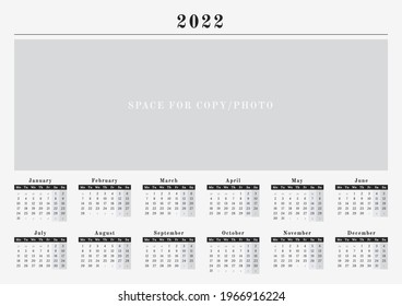 Year calendar 2022 in a wall horizontal format, black and white design with a space for copy or logo with mondays as a first day in week