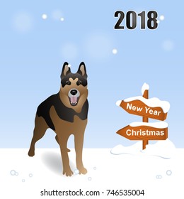 Year of the dog 2018. Winter. A German shepherd is standing in the snow. Wooden sign with snow