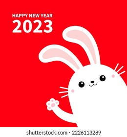 The year of the rabbit. Happy Chinese New Year 2023. Bunny in the corner waving paw print hands. Cute kawaii cartoon funny smiling baby character. White animal. Red background. Flat design Vector