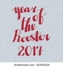 Year of the Rooster 2017 Authentic Calligraphic Logo Lettering - Pale Red Grunge Elements on Blue Rough Paper Background - Vector Calligraphy Style