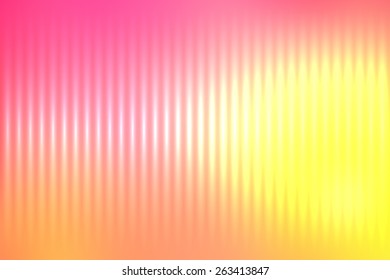 Yellow abstract blur colored background with defocused vertical rays of light.