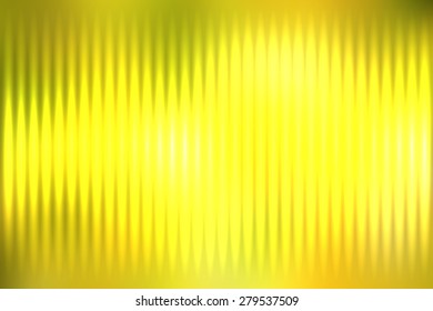 Yellow abstract blur colored background with defocused vertical rays of light.