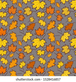 Yellow autumn leaves on a gray background, seamless pattern
