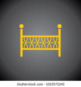 Yellow baby crib icon on black background.