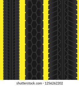 Yellow background with black tire track silhouettes