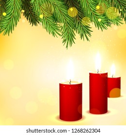 Yellow background with branches of a New Year's tree in the lights and butning candles