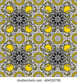 Yellow background with golden elements. Golden pattern. Remarkable with floral pattern. Vector golden floral ornament brocade textile pattern.