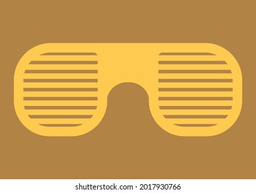 Yellow beach goggles on orange background.