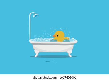 The yellow big duck takes a bath filled with foam and bubbles, on a dark blue background, on the floor are spray and foam bubbles