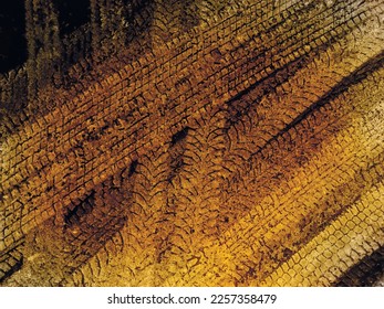 Yellow and black vector grunge background with texture of tire tracks on snow. UHD 4K wallpaper. For screen, desktop, website design, overlay, stencil, background, stylization, design and polygraph