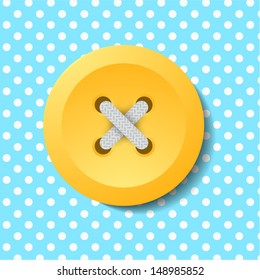Yellow button on the background of peas