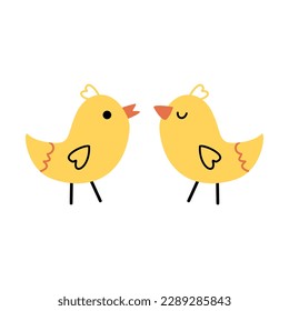 Yellow chick stands on its paws