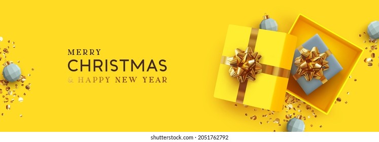 Yellow Christmas Banner. Xmas Background Realistic Design Open Gifts Box With Surprise, Bauble Ball 3d Render And Glitter Gold Confetti. Horizontal New Year Poster, Greeting Card, Headers Website