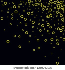 Yellow circles on a black background. Flying confetti. The contour of intersecting circles.