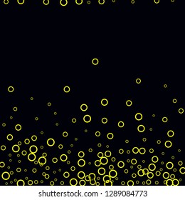 Yellow circles on a black background. Flying confetti. The contour of intersecting circles.