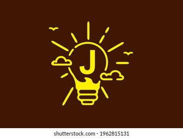 Yellow color of J initial letter in bulb shape with dark background design