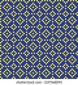 Yellow cross-stitch knitting pattern on blue background. Yellow square dots on blue backdrop. Colored fabric pattern design for sale. Knitting handicraft art.