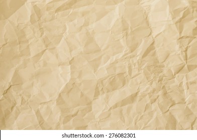 Yellow crumpled paper as textured background