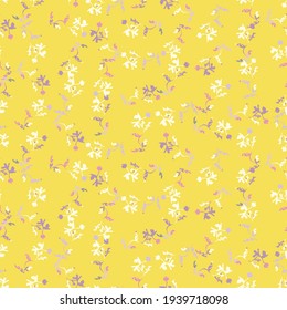 A yellow ditsy floral seamless vector pattern