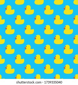 Yellow duck seamless vector patternon blue background