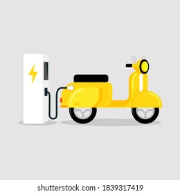 Yellow electric scooter with EV electric vehicle charging station.