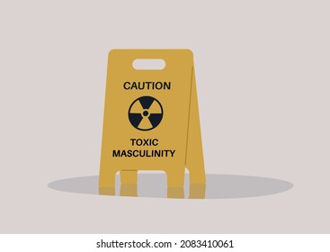 A yellow floor sign warning about toxic masculinity, the idea of manliness as being defined by domination, homophobia, and aggression