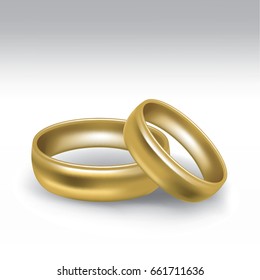 Yellow gold wedding rings in pair isolated on isolated on white background