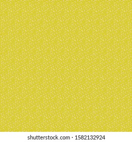 Yellow granulated surface crossed by subtle zigzag stripes with glitter effect. Wallpaper texture. Decorative background.