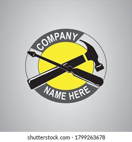 Yellow and Grey Hammer and screwdriver logo