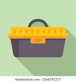Yellow and grey plastic toolbox is lying with its shadow