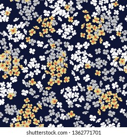 yellow and grey small flower bunches pattern on navy background