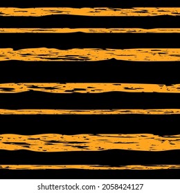 yellow grungy stripes on black repetitive background. vector seamless pattern. fabric swatch. wrapping paper. continuous print. geometric element for home decor, textile. modern stylish texture