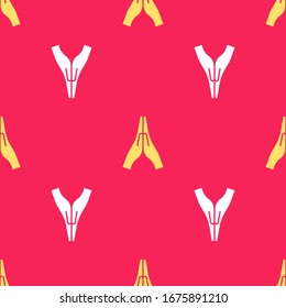 Yellow Hands in praying position icon isolated seamless pattern on red background. Prayer to god with faith and hope.  Vector Illustration