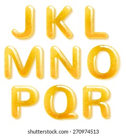 Yellow honey jelly abc alphabet. Glossy letters isolated on white background.