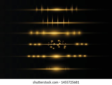 yellow horizontal lens flares pack. Laser beams, horizontal light rays.Beautiful light flares. Glowing streaks on dark background. Luminous abstract sparkling lined background.