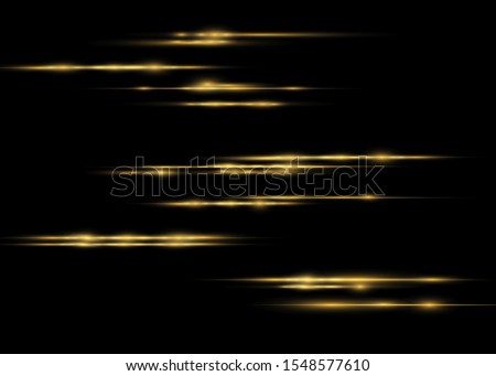 yellow horizontal lens flares pack. Laser beams, horizontal light rays. Beautiful light flares. Glowing streaks on dark background