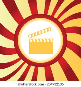 Yellow icon with image of clapperboard, in the middle of abstract background