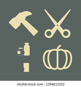 yellow icon set with pumpkin, hammer and scissors vector illustration