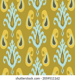 Yellow ikat pattern - traditional art,  silk fabric, beautiful background. Fashion industry.