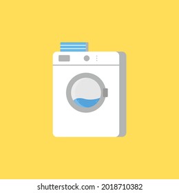 Yellow laundry room with washing machine
