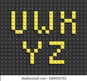 Yellow Letters Of Alphabet From Black Building Lego Bricks Background. Lego Bricks Letters. Lego Alphabet